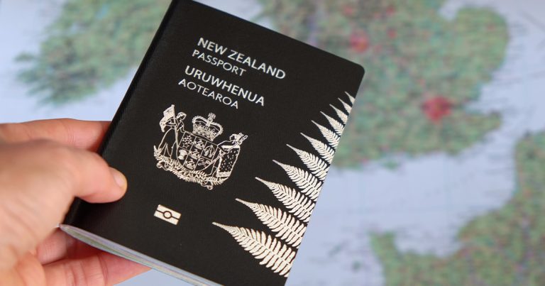 New Zealand passport and Europe map stock photo