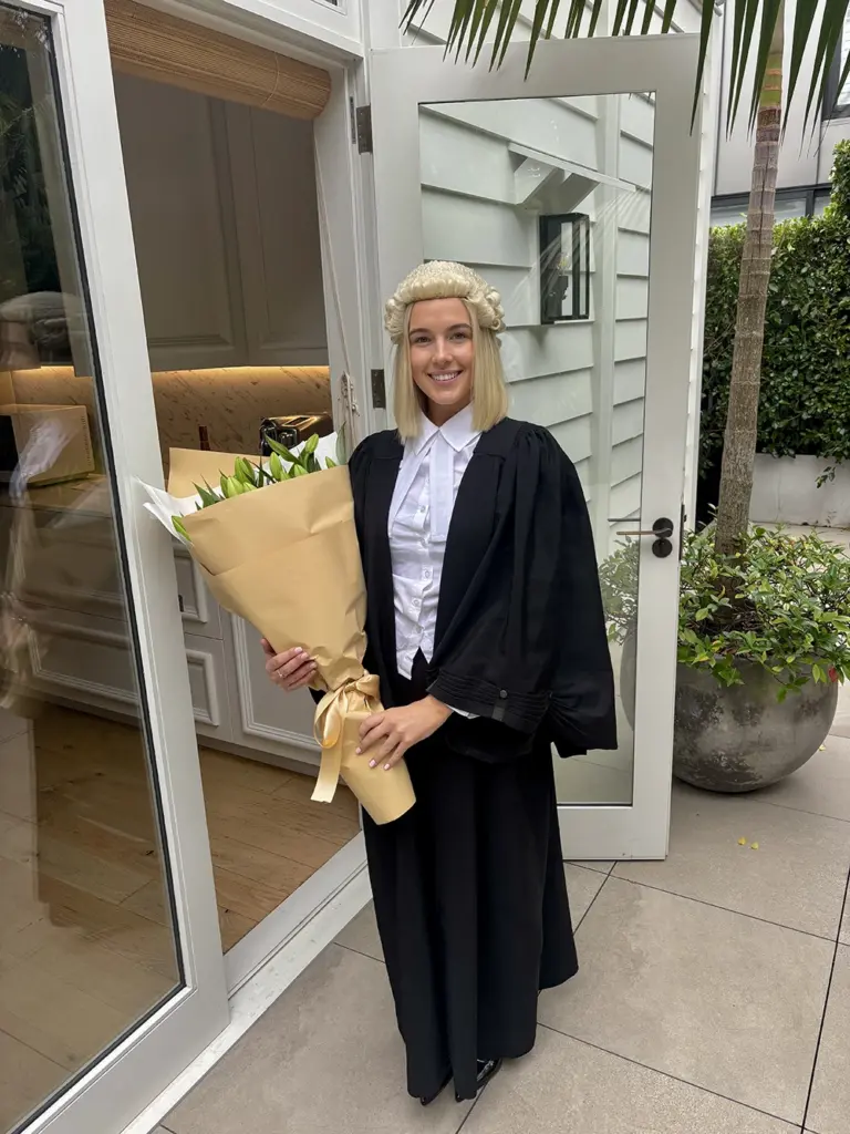 Millie-Fox-from-AWS-Legal-with-Flowers-celebrating-admission-to-the-bar